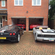Scott’s then-new purchase at home with his cars.
